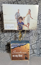 Load image into Gallery viewer, Photo Block Clip with Seahorse Charm & "Seashores on my mind" Wood Grain