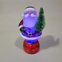 Load image into Gallery viewer, Lighted LED Santa with Tree Mini Shimmer Glitter 3" x 2" Durable Acrylic Snow Globe
